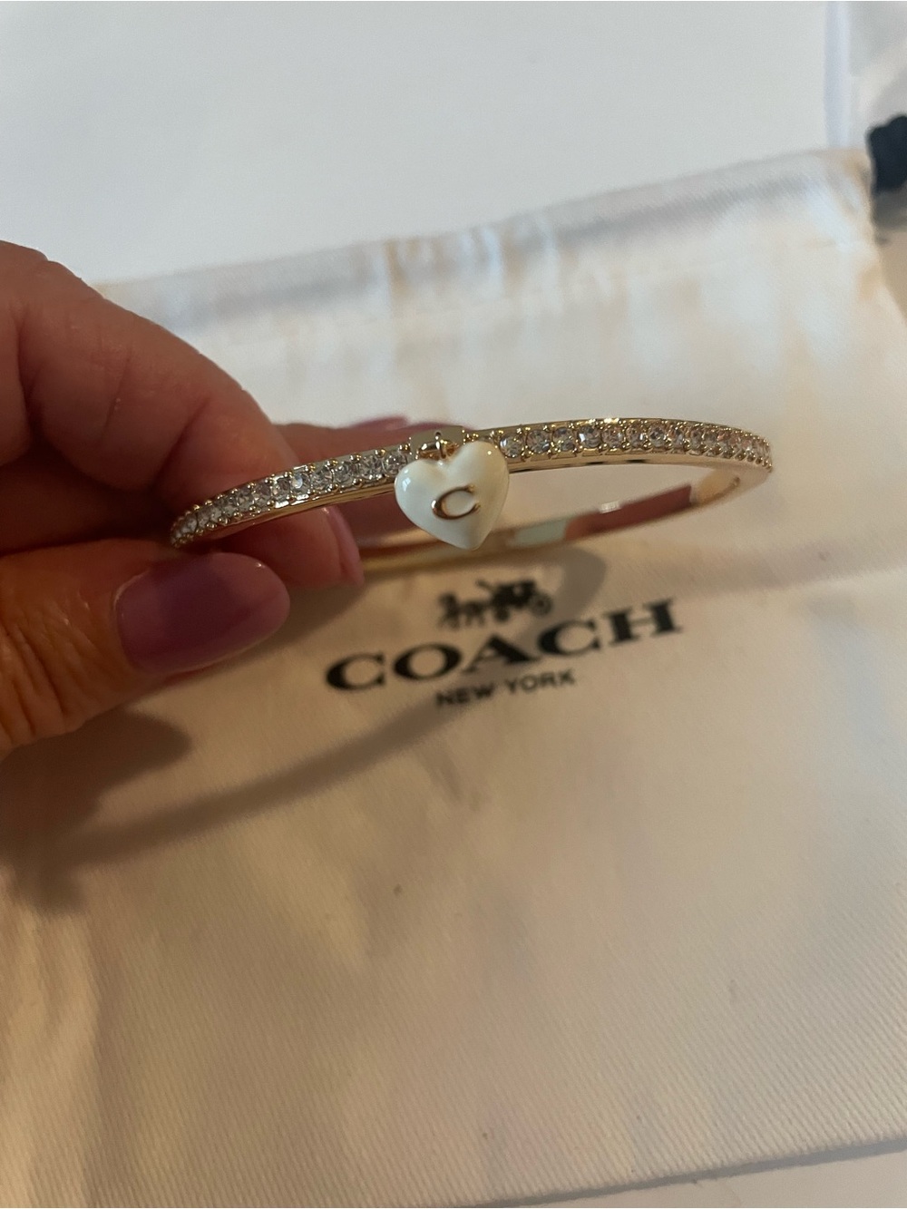 Coach Gold-Tone Pavé Heart Bangle with White Enamel Charm